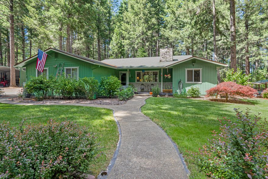 Back on the market at no fault of the property. Don't miss out on this incredible opportunity! Welcome to 200 Cornett Lane! This beautiful property is part of the Idle Wild Subdivision, a prestigious area in the Illinois Valley. Feel relaxed here! The Property is tranquil and boasts a majestic forest unique to Southern Oregon. Come have fun in your large dream shop with tall roll-up pass through doors! Plenty of room in the oversized secured metal carport to safely store toys, equipment and treasures. If that's not enough there is an additional supersized metal carport for your RV, Boat, etc. Property is flat, fenced and is a full 5 acres! The home is beautifully landscaped & well taken care of. Enjoy, this 3 bed 2 bath, 1892 sq ft split floor plan with 2 car garage, and cozy wood stove, hard wood & tile floors as well as vaulted ceilings in the living room.  Also, the kitchen has granite counters tops! Easy drive to amenities and coast. This is a must see!