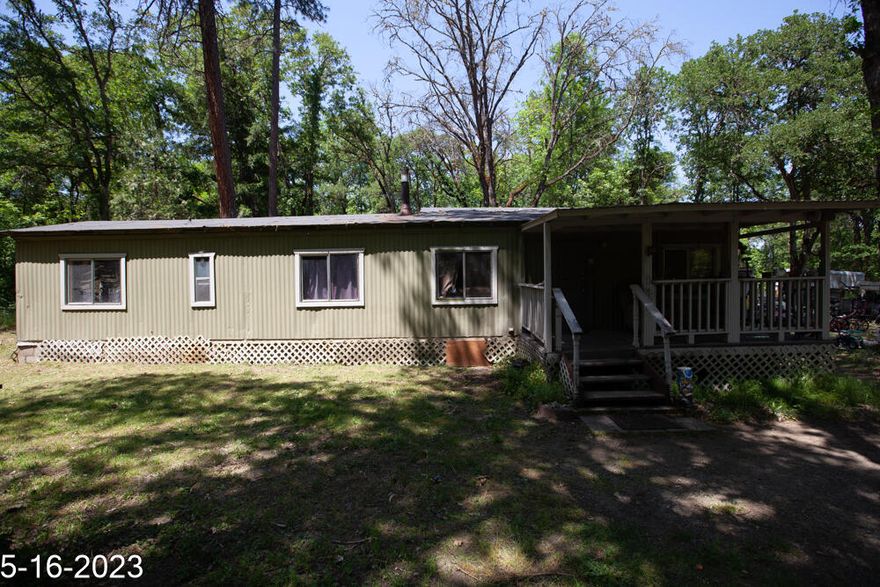 Priced to sell fast! Here's your chance to own acreage in highly desirable Williams.  Beautiful piece of property with seasonal creek.  Mostly fenced. Live in existing home or build your own.
