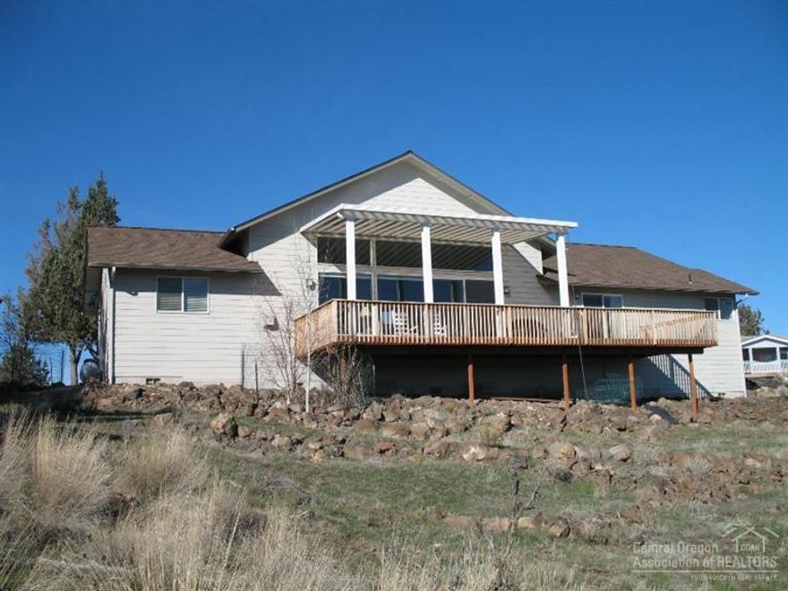Spectacular views of the Crooked River Gorge from the deck are just one of the unique features of this custom built home. Large picture windows in the Great Room afford great views and let in plenty of natural light. Owner's suite features a walk-in closet. 2 guest bedrooms compliment the owner's suite & one does double duty as a den. Low maintenance yard with drought resistant plants & an automatic sprinkler system. Built in 2007 this home is in excellent condition and reflects pride of ownership.