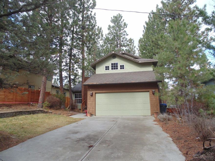 Fantastic Westside location with beautiful, mature pine trees for added privacy! Vaulted ceilings in living room with new skylight for added natural light. Brazilian cherrywood floors, an open kitchen with a breakfast bar and a family room that opens out to the large deck & backyard. Spacious master bedroom with vaulted ceiling, bath, & walk-in closet. New 30 year roof, new 97% efficient furnace, new wool carpet and fresh interior paint! Close to all Westside restaurants, pubs, mountain biking & More!