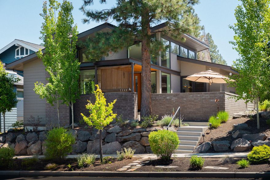 This stunning Northwest Crossing contemporary style single level home on a quiet tree lined street features two bedrooms with office/potential third bedroom, two bathrooms and premium finishes throughout. Designed by Neal Huston & Associates and built by Greg Welch Construction, the attention to detail and modern flair are truly a dream come true. Entertain in front of the fire in the Great Room or outside on the private patio or private courtyard/deck. Earth Advantage Certified, this home boasts dual zone high efficiency heating/cooling, Quartz countertops, stainless steel GE Café appliances, Grohe & Kohler fixtures, hardwood flooring, horizontal grain walnut cabinets, tile shower and bathtub...just to name a few designer features. Close to Compass Park, Sunrise Park, NWX Farmers Market, shops, restaurants, trails. Truly a gem in the heart of Bend.