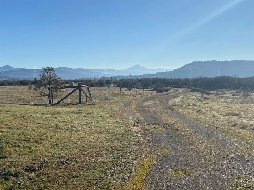 Beautiful property with wonderful views of Mt McLoughlin and Upper Table Rock. Property is flat usable ground. There is a small horse barn with 6 stalls that needs some TLC, a 2 car carport with cement floor and also a small straw bale shed which could be used for storage or a tack room. Property is partially crossed fenced and there is an automatic gate for access onto the property. Very quiet location near Kriselle Cellars, The Rogue River and Upper Table Rock. Do not miss this opportunity to build your dream home on a great piece of property. Value is in the land. Property being sold as is.