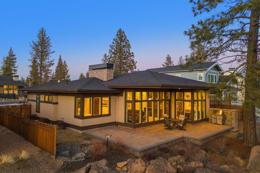 Located in one of Bend's coveted Firewise neighborhoods, this Prairie-style home inspired by Frank Lloyd Wright offers modern living with everything at your fingertips so you can focus on living your best life. Set on a desirable quarter-acre lot, serene forest views provide privacy & bring nature into the heart of the home. Expansive windows & spacious paver patio blur the lines between indoors & out. A thoughtfully designed layout features a chef's kitchen with granite counters, full-height slab backsplash, Wolf & Subzero appliances, & custom built-ins for smart storage. The luxurious primary suite includes heated bathroom floors, a marble dual vanity, & XL custom shower with a 7' rain-style head, shower wand, & in-wall spray. A versatile 4th room off the garage could be gym, or creative space. Tech-savvy amenities include built-in speakers & media integration, plus a Hartley Botanic greenhouse for gardening. Come see this home in person to appreciate the quality it offers.