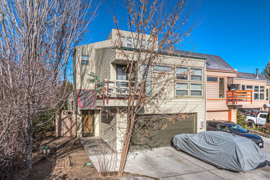 Nestled at the end of a private drive, away from road noise, this charming townhome is ready to be your new home or kept as an investment. Each of the three levels has its own bedroom and full bathroom for maximum privacy. One enclosed patio is available on the ground floor and a balcony off the 2nd floor main living area as well as vaulted ceiling in the great room and large windows to let the light in. Built with passive solar architecture, the structure is designed to trap heat in the winter and disperse it in the summer. Only minutes to downtown, medical centers, Costco, breweries and major shopping. HOA maintains the exterior and roof, landscaping, trash and snow removal.