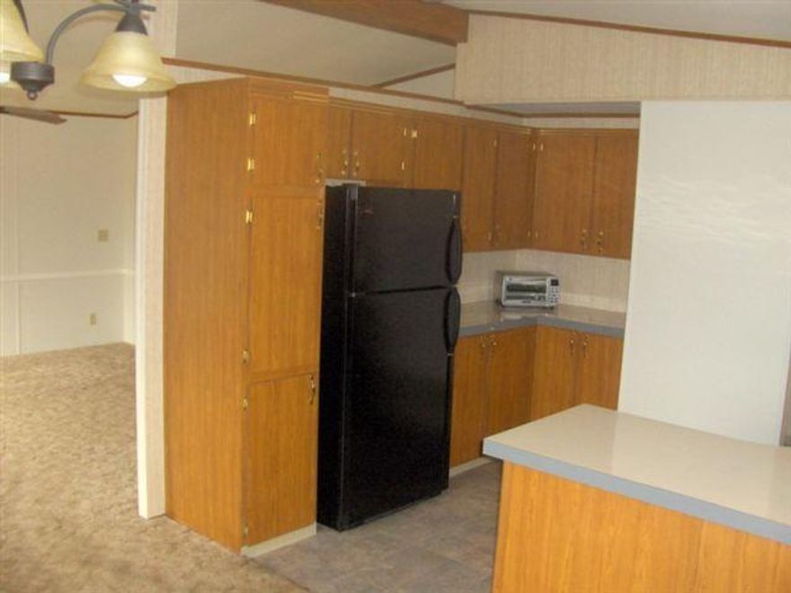 Lovely Home With A Big Covered Deck, Wonderful View Of Lake And Waterfowl. Home Is Immaculate Condition And Is Spacious Lt. And Airy.Incudes Refrigerator ,Glass Top Electric Oven Range,Dishwasher. Master Bdr. Has Walk-in Closet And Bath. Both Bedrooms Nice Size. 55 And Older Park, Rent Is $220 @ Month, Buyer Must Have Park Approval,Park Pays Water,Sewer And Trash.