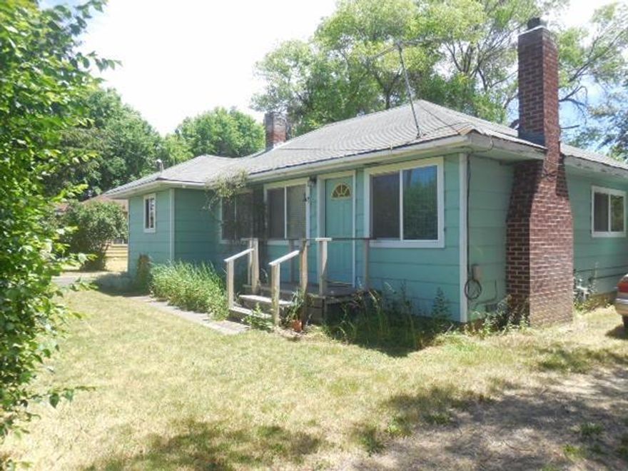 Cozy three bedroom home situated on almost a half acre in the suburbs! Over 1400 square feet of living space, attached hobby shop (could be converted back into attached garage), plenty of storage space and a built in BBQ on the back patio for entertaining. Plenty of room for a large animal or perfect for smaller 4-H projects!