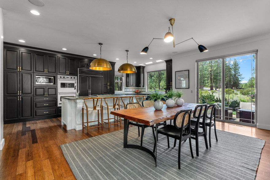 Gorgeous home nestled on a third of an acre in the well established neighborhood of Sunrise Village, perfectly located between the Deschutes river & Century dr., 5 minutes to town. Amazing floor plan that adapts to all kinds of living options. Main floor has a stunning chef's kitchen including Subzero fridge, Viking double oven, warming drawer & cooktop, large island with barstool seating, opening to dining space with built-in display hutch & view of South Sister. Cozy living room w/ inviting fireplace & room to gather, dedicated office, separate den, full bath & large laundry room. Upstairs has a palatial primary suite with dual walk-in closets, gracious sitting area w/ view of South Sister, large bathroom with Japanese soaking tub & steam shower, 3 bedrooms & two bathrooms, one jack/jill & an office/den area with a closet that could be 5th bedroom. Heated driveway, bluetooth whole home sound system & beautifully landscaped grounds round out the main features of this special property