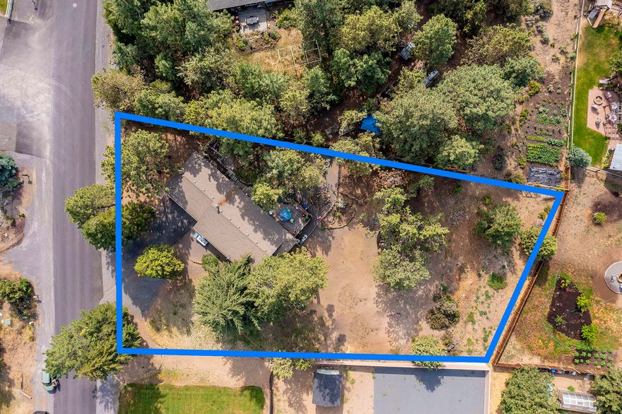 This property is perched on a hard-to-find half-acre+, fully fenced lot located in the extremely desirable Desert Woods neighborhood. Plenty of room to create your dream home, remodel and expand the existing house, or keep it as is. There is ample space to add a separate garage for RV storage as well as a shop or ADU. Mature landscaping abounds.