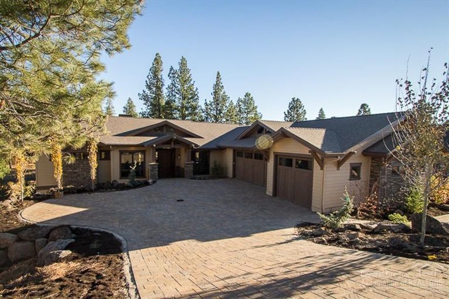 Incredible, spacious custom home in The Reserve at Broken Top. Immersed in luxury finishes and the latest amenities, this home features solid surface counters and vanities, beautiful hard-wood floors, wood cased windows and solid wood doors. Chef's kitchen includes 6 burner double oven range and massive granite countered island with farm style sink, custom cabinetry, built-in wine fridge and espresso machine. Driveway and covered deck and patio are finished with pavers. Full Sonos surround sound.