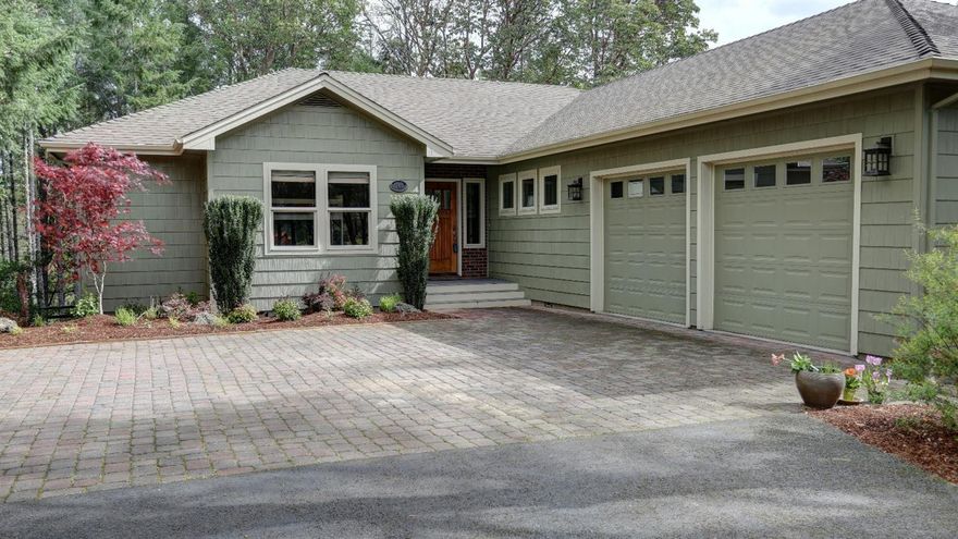 Travel along a paved country lane to this beautiful home, nestled on a wooded knoll in an area of upscale homes. Pavers grace the driveway apron'' and set the stage for the quality surprises within. Elevated ceilings and window walls throughout!The kitchen features slab granite counters, cherry wood cabinets, beautiful backsplash and tile floors + walk-in pantry; the dining room is conveniently adjacent. The highly crafted master suite on the main floor features a 5-piece bath incl. a jetted soaking tub with wooded views. Lower level includes large game room, and two bedrooms & bath. The garage is extra deep, with a generous shop or work space. Wildlife, including a family of deer and a few younger bucks, visit often! Enjoy fruit trees, including apple and pear, as well as stone raised bed gardens for drip line feed vegetable gardening, all within the fenced, protected areas of this beautiful property. Abundant flowering plants attract birds, hummingbirds, and butterflies! Enjoy!