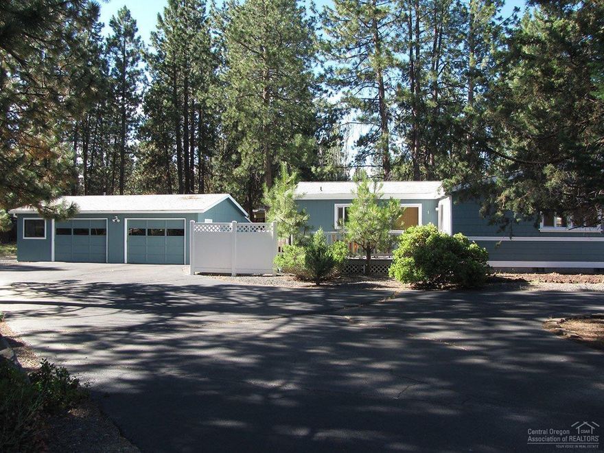 This well-cared for manufactured home is situated on .34 acre. It has a peaceful, park-like setting just minutes from Bend's finest restaurants, shopping and Central Oregon Recreational areas. This home features both formal & informal living room and dining areas. Large kitchen with lots of cabinets for storage. Semicircular driveway with plenty of parking for an RV. Community clubhouse and swimming pool.