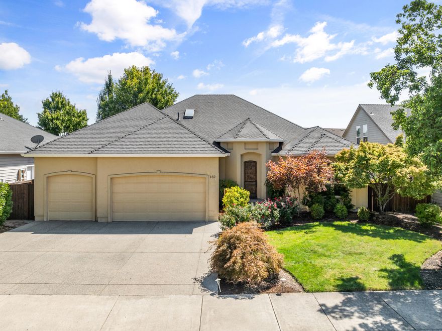 Set in the sought-after Eagle Point Golf Course community, this 4-bedroom, 3-bath home offers a perfect balance of elegance and comfort. A grand entry leads to the living area with coffered ceilings, formal dining, and an open granite kitchen with large pantry, breakfast nook, and built-in buffet. The primary suite is a private retreat with double sinks, a jetted tub, oversized slate shower, and walk-in closet. Outdoors, enjoy low-maintenance landscaping, covered patios, and a tranquil water featureâ€”ideal for relaxing or entertaining. With tile flooring, a 3-car garage, and an impressive 8' solid walnut arched front door, this home combines quality craftsmanship with a lifestyle you'll love.