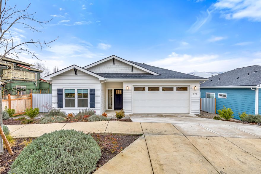 Single-level home by Taylored Elements Construction with 4.98 kW solar system and Earth Advantage Platinum certification located within a one-mile radius of parks, schools, shopping, and downtown entertainment! Open-concept living area with high ceilings, recessed LED lighting, wide-plank engineered Oak floors, natural gas fireplace with brick surround, built-in cabinets and shelving, kitchen with quartz counters and dining island, stainless LG appliances including 6-burner gas range with convection oven, pantry, dining area with sliding glass door to covered composite deck with view of Grizzly Peak. Primary bedroom with ceiling fan and full ensuite bathroom with quartz vanity, tiled shower, and walk-in closet. Two guest bedrooms and full guest bath with quartz vanity and tiled tub shower. Laundry room with GE washer and dryer, mudroom with built-in bench, and two-car garage with Siemens EV charging. Fully fenced backyard with grass lawn and sunny gardening areas. Inquire for details!