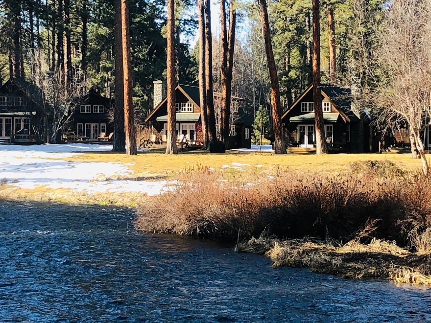 Welcome to a very special place 'Metolius River Resort' ON the Metolius River. This deluxe cabin has the finest in upgrades, granite slab countertops, custom cabinetry, river-rock fireplace, pine accents along with smooth-textured walls, and includes a TOP OF THE LINE furniture package. No expense was spared in creating a beautiful and inviting place to warm up by a cozy fire or sip wine on the deck just feet away from the lazy river and amongst the whispering pines; this cabin is the PRIDE of the fleet in it's small community and has a premium location. Just a short walk to the general store, Hola Restaurant, trailheads, and more! Maybe the best part....this vacation property can pay for itself! As part of private vacation accommodations excellently managed and maintained--this cabin is offered to discerning guests, making this a smart and great investment.