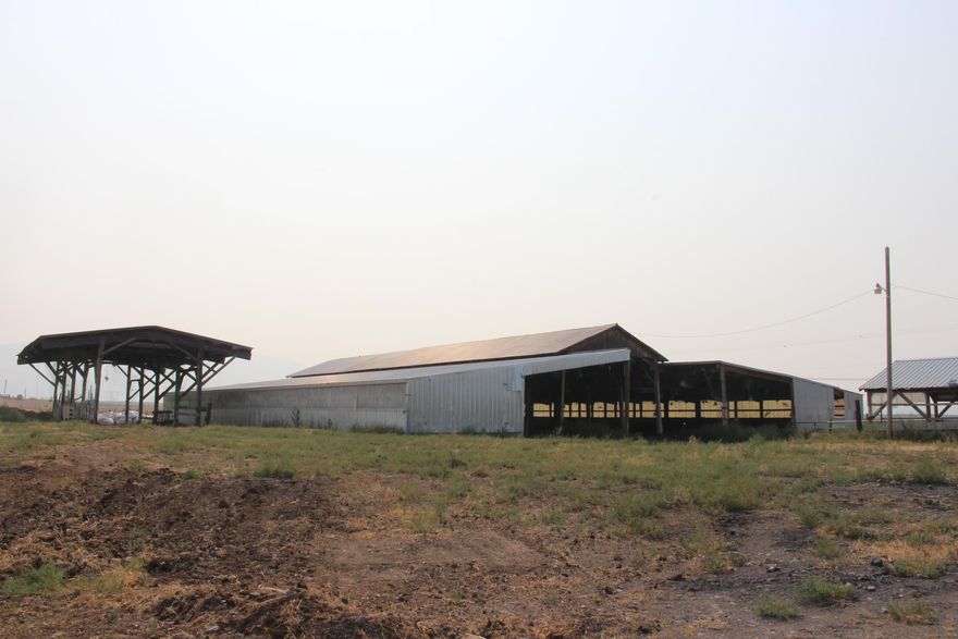 Motivate Seller for this former dairy farm of 77.27 acres. Pasture and pond. EFU-C zoned with 3 homes: 2 manufactured and 1 concrete block with a basement.  Main home may be subject to Life Estate. 3 large barns used for hay plus one milking barn, 2 stainless steel holding tanks, Fenced and cross-fenced. ~~ Not operated for several years. A HUGE bargain at list price!!!