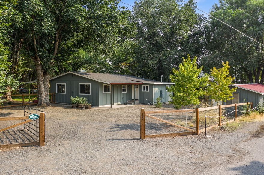 Super unique opportunity to own this awesome property right on Ochoco Creek in the heart of Prineville. Walking distance to Wild Ride Brewery, Grocery, Starbucks, Schools, Parks, & City Center. Enjoy 140' of direct, private creek frontage. Catch fish out your back door, wade in the creek, enjoy the cascading water sound as it meanders through the property. Huge trees canvas the entire perimeter. The lot is truly one-of-a-kind. Home was remodeled in 2018 & has 3 bedrooms & 2 baths. There are 3 additional outbuildings including: a detached with roll up door, new windows, siding, roof, & wired for 220v power. A large workshop w/concrete floors, new a/c & heating, electrical, 220v power, & new windows can be used for home office, gym, bonus room, or shop. Attached room off the back is currently a home gym. Third building in front could be a hobby room, storage, or turn into an ADU & Airbnb. Enjoy the endless recreational or business opportunities right from your property.