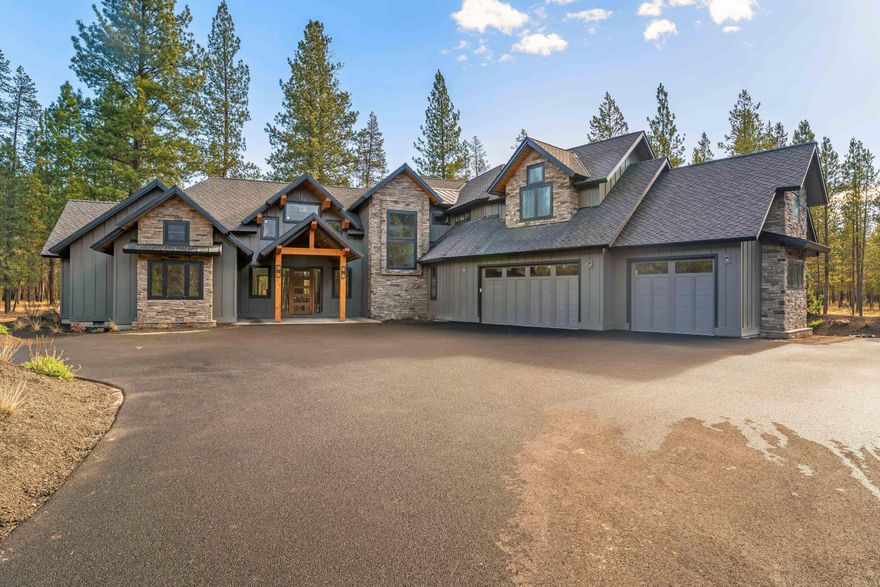 Discover refined mountain living in this exceptional 38-acre estate offering privacy, elegance, and comfort. The 4,412 sq ft home features 5 bedrooms and 5.5 bathrooms, including two main-level primary suites with spa-like baths, zero-entry showers, soaking tubs, and walk-in closets. The open floor plan highlights hardwood floors, vaulted ceilings, and a great room with gas fireplace and panoramic glass doors leading to a covered patio—ideal for entertaining or relaxing. The gourmet kitchen offers soapstone countertops, a gas range with pot filler, large island with eating bar, and a walk-in pantry. Upstairs includes additional bedrooms with private en-suites, a spacious bonus room, and guest bath. Additional features include a laundry/mudroom, three-car garage, and optional space for a future pole barn. Conveniently located near Mt. Bachelor, Sunriver Airport, and the Deschutes River. Bordering Vandevert Ranch and Caldera Springs Resort.  No HOA fees or restrictions.