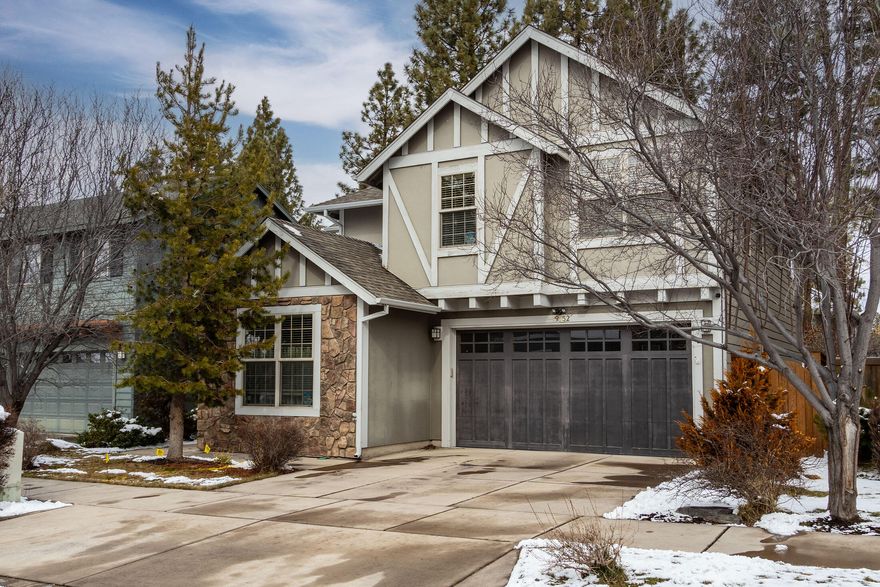 Warm and inviting describes this beautiful home with 4 bedrooms plus den with open floorplan and several updates including new hardwood flooring, new interior paint, new refrigerator, dishwasher & microwave, new kitchen sink & disposal, new hot water heater and newer carpet.  Greet your guests in the spacious entry.  Entertain in the great room with a nicely-done, gas fireplace, spacious dining area, and large kitchen with several alder wood cabinets, stone countertops, island with breakfast bar & wine fridge!  Rest well in the primary bedroom with warm finishes, vaulted ceiling, ceiling fan and walk-in closets.  Primary bathroom offers attractive, extra built-in drawers & shelving, double-vanity, soaking tub, shower and enclosed toilet. Access the Deschutes River Trail and park in the neighborhood!  Located close to the popular Pine Ridge Elementary, few minutes to the Old Mill Shopping District & downtown Bend! Electric car plug-in ready, 50 AMP 220 V.