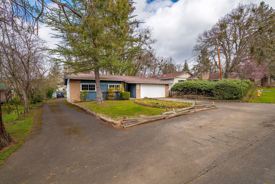 Welcome to your dream home located in the highly sought-after East Medford neighborhood! With 3 cozy bedrooms and 1.5 bathrooms, this property is the perfect canvas to make your own. The additional detached garage provides ample space for all your toys, or even an income-generating rental. With some updates, the possibilities for this property are endless. Plus, enjoy the spacious .26 acre lot that is perfect for outdoor entertaining and relaxation. Don't miss out on this amazing opportunity to own a piece of paradise in East Medford!