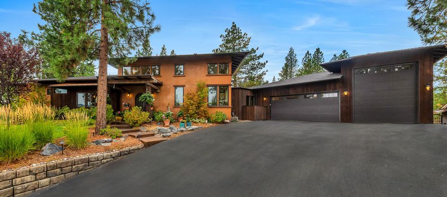 This artistic & eclectic Shevlin Ridge custom home seamlessly blends outdoor living with the charm of an Italian farmhouse. Exceptionally private .40 acre lot with serene views of Awbrey Butte & the Paulinas. Easy access to trails, parks & Westside amenities. Open & airy great room with loft, gas fireplace & charming kitchen furnished with live edge quartzite counters, oversized island, DCS 5 burner range, copper & travertine sinks. Dining area flows smoothly through French doors to a backyard oasis with timber framed cover for BBQ & Italian wood-fired pizza oven, garden beds & a hot tub. Primary suite opens directly to the concrete patio & pergola covered seating area & features 10' ceilings, defined office space, bath with travertine floors, dual head shower & two vanities. Unique details abound from reclaimed posts & beams to vintage hardware & repurposed doors. 3 car garage includes 35' RV bay with 12' door plus rooftop solar; just a few of the surprises awaiting you here!