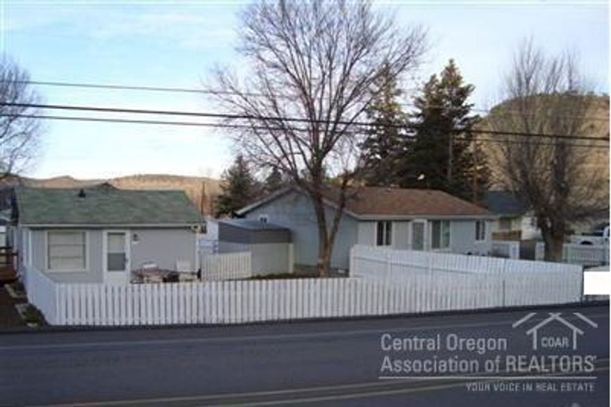 Great investment property with several possibilities. This offers the opportunity for rental income or residence with guest quarters or both. 2 homes on 1.15 acre lot. 1 home is a 2 bed, 1 bath residence. The other is a 3 bed, 2 bath manufactured home. 980 sqft shop that has a small guest quarters inside - living room and bath downstairs with a bedroom/closet space above shop floor (loft). Shop with loft is approx 1288 sqft.