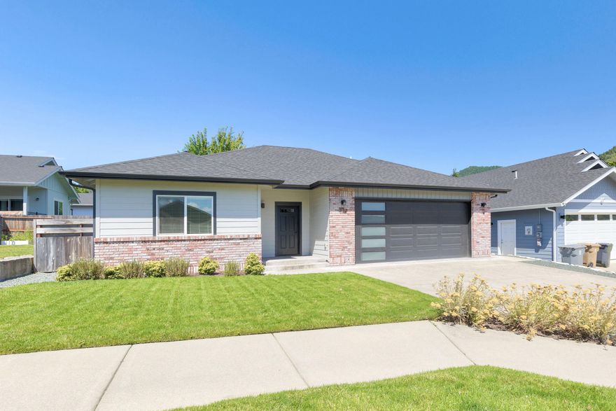 This move-in ready 2-bedroom, 2-bath home built by Cliff Woodruff offers charm, comfort, and convenience in one inviting package. Thoughtfully maintained, the open-concept layout features a stylish kitchen with an island, stainless-steel appliances, and a dedicated dining area—perfect for everyday living or hosting guests. The spacious primary bedroom includes a walk-in closet and a modern en-suite bathroom. Step outside to a covered back patio ideal for entertaining, surrounded by a fully fenced yard with a garden area and low-maintenance landscaping. Located just minutes from shopping, dining, schools and local amenities, this home combines peaceful living with easy access to town. A must-see property that's ready to welcome you home!