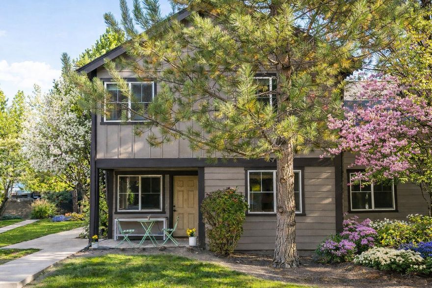 Located in the heart of Bend's highly sought after Westside, this home places you just moments from trails, local coffee shops, and the vibrant energy that defines the area. Thoughtfully designed to capture the essence of Northwest living, the residence offers light filled interiors, warm finishes, and effortless access to everything Bend has to offer. The main level features a well appointed kitchen with new appliances, convenient in home laundry, and a comfortable living space ideal for both everyday living and entertaining. Upstairs, two inviting bedrooms provide flexibility for guests, a home office, or a private retreat. Step outside to a covered patio, perfect for quiet mornings or evening relaxation. The home showcases beautiful new wood flooring throughout, while community maintained landscaping ensures easy, low maintenance living. With its prime Westside location and move-in-ready condition, this property presents a rare opportunity to enjoy simple, stylish Bend lifestyle.