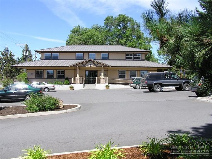Office park/campus. 2+ acres with two office buildings, one warehouse/shop building and land to build approximately 14,000 sf building. Owner currently occupies the warehouse building and the office buildings are 75% occupied with a local tenants. Good opportunity for an investor/developer to enjoy existing cash flow and develop the balance of the property, or a great opportunity for a company desiring a campus setting with room to grow. Much of the infrastructure is in place for additional development.