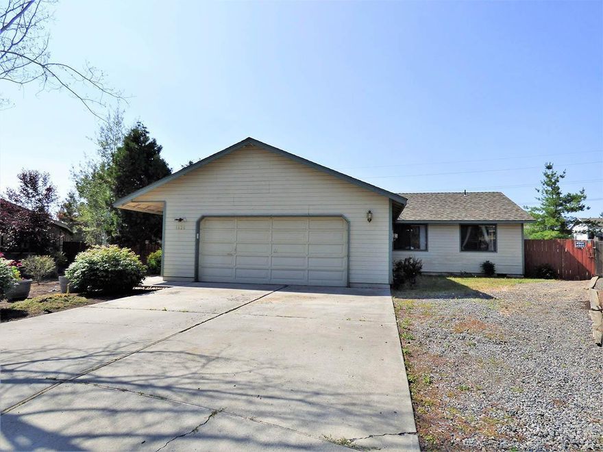 Single level home on large lot with RV parking located in a cul-de-sac. Double door entryway, huge living room with vaulted ceiling, skylight, ceiling fan & sliding glass door to the back deck. Good sized dining area, decorative lighting & large window. Spacious island style kitchen, stainless steel appliances, skylight, breakfast bar and plenty of counter space. Nice master bedroom separation, 2 bedrooms & full bath on one side of the home and master bedroom on the other. Master bedroom suite features a double vanity, linen closet, pocket door, skylight and a door leading to the back deck. Lots of wood accents and trim throughout the house. Double car attached garage, work bench and storage shed, old growth trees, shrubs and plantings.