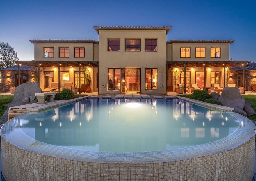 Live life as a fairy tale in a 5000sqft + Estate nestled in the majestic setting of Ranch at the
Canyons. Situated high on the rim, this manor overlooks the sounds and views of the Crooked
River. World renowned Smith Rock and Monkey Face gaze upon the remarkable swimming pool and peer into the immense french-doors of this enchanted home. Westerly views of the Cascade Mountain range make a commanding statement. ICF construction and intricate design throughout the home create a one of a kind custom charm. Join the exclusive lifestyle at Ranch at the Canyons and write your story from this extraordinary abode.