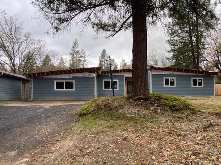 Tons of potential with this rural Grants Pass property.  Home is currently under construction and is a perfect project to turn into your dream home.  Property offers over 1 acre and has a detached garage and car port along with large RV parking.  Back yard offers a pool and large patio area.  Inside offers large sq ft with an open floor plan that offers a large living room that leads to a deck area.  Large kitchen area leads to a family room.    Come check out the possibilities.