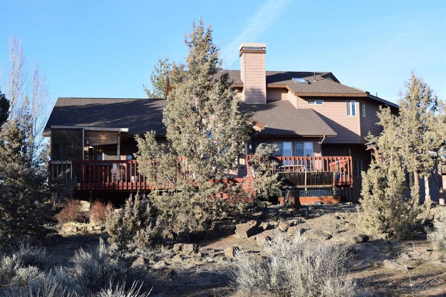 Situated on 14 private acres w/approx 8 acres of COI irrigation. Buried main line. Well maintained home. 2670/sf. Vaulted beams, ceilings w/massive windows, light & bright home. Hardwood floors, granite counters. Formal living, Family. Large pond. Cascade Mountain Views. Dog run kennel, insulated & concrete. Fenced and cross fenced. Easy access to ride out w/public lands nearby.