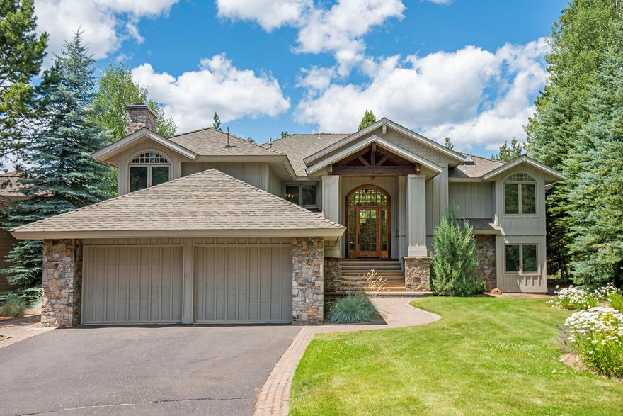 Truly a rare find! High-quality custom home designed by Don Mackprang, built by JC Reeves on a one-of-a-kind lot with privacy, peek-a-boo mountain views & golf course frontage! Tucked away in the back of a quiet cul-de-sac, with sweeping views of the Woodlands GC, you must see this home to appreciate the craftsmanship, quality, and setting fully. A generous floorplan includes three stone fireplaces, two stairways, a media room just off the kitchen, and a family room downstairs, allowing everyone plenty of space. Stunning entry, with Cherry hardwood staircase and Cherry hardwood flooring throughout the upper living area. Spacious primary suite with custom built-ins, a sitting area, private deck access, and expansive primary bathroom finished with Travertine throughout. The large upper deck enjoys expansive views with plenty of room for dining, relaxing, or reading. Guest suite downstairs, plus 2 more bedrooms with a jack-and-jill bathroom. High end touches throughout, triple car garage