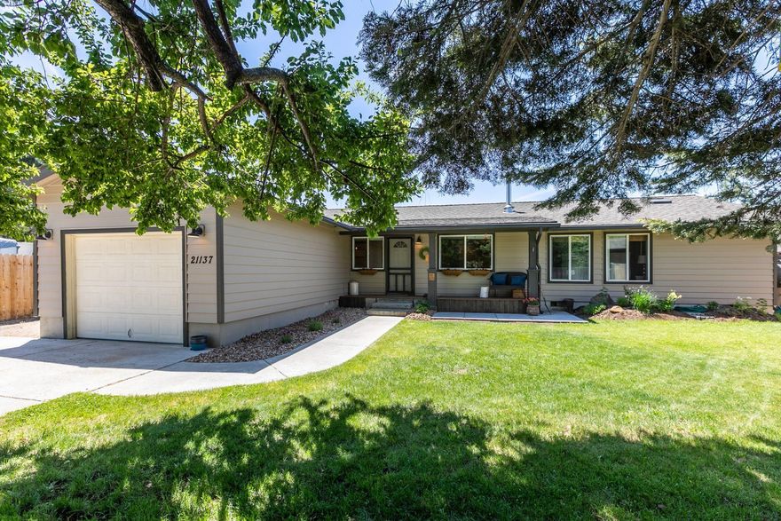 Enjoy Bend and close access to shopping while living in a quiet neighborhood with your own half acre! This house has been fully updated and remodeled and lives large with its open floor plan and bright natural lighting. With a half acre of land there is plenty of room for kids, pets and gardening, and you can park your RV on the side of the house with full hookups! House features wood floors, ductless mini splits for heat and air conditioning and a wood stove in the great room to keep the house cozy. There is room to build a shop or an ADU- or both! Agents ok. 4Bd/2ba 1728sf 23,086 sf / .53 acres