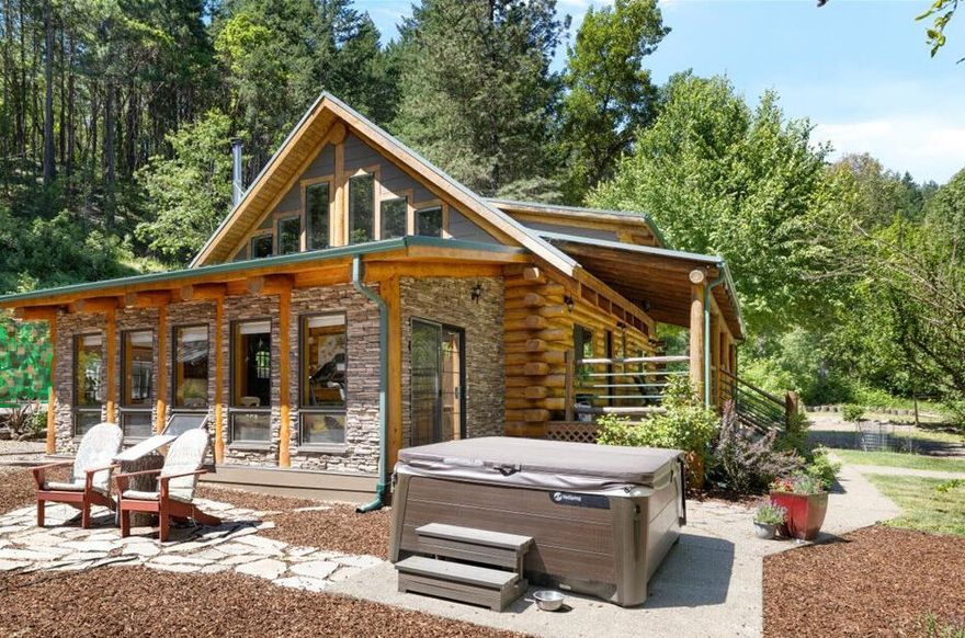 Bring Offers! Private, wooded 8.22-acre sanctuary with log home, just minutes from Historic Jacksonville & many acclaimed wineries. Enjoy this peaceful and homey 4 bed & 2 bath retreat knowing that most of the maintenance has been complete. All you need to do is relax & enjoy the privacy as well as the many other exceptional amenities throughout such as: all new upscale kitchen with a large island, elegant red oak flooring, open concept layout with soaring ceilings, a cozy sunroom complete with heated floors. A spacious master features vaulted ceilings, tastefully remodeled ensuite walk-in tile shower & large walk-in closet, and a tranquil reading nook with serene outdoor views. The property also offers a newer privacy and security entrance gate, seasonal creek, a 14 x 16 workshop, carport, and a welcoming circular driveway leading to a wonderful front porch perfect for gatherings or your rocking chair. Could make a nice VRBO or second home. Owner will consider owner carry terms.