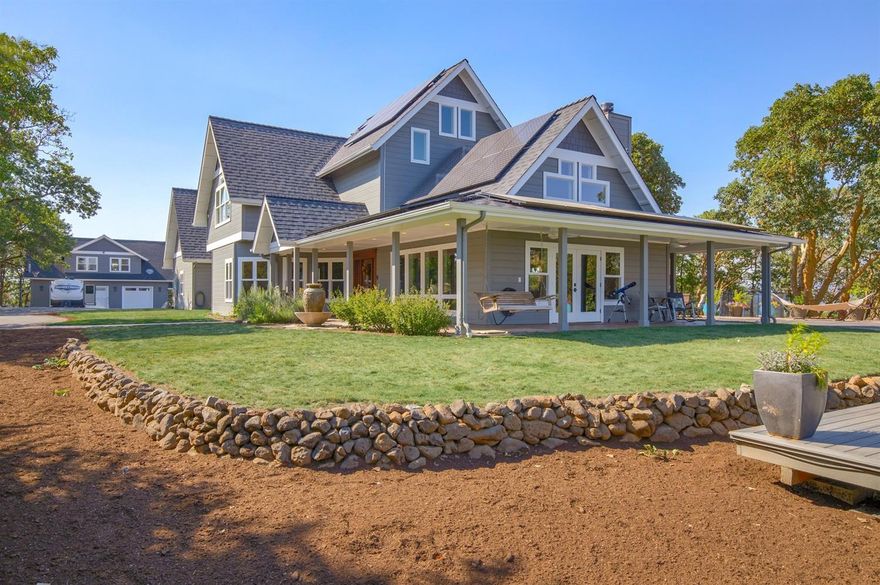 Sitting atop a hill w/ endless views on 20 private acres, the quality of this property shows! Completely remodeled in 2016, the open floor plan is complemented by high-end natural surfaces. The main living area has open beams, wall to wall windows, modern wood stove & flows to the chef's kitchen w/ Wolf, Bosch & Sub-Zero appliances, butler pantry & cocktail bar. The main floor master suite has views of Table Rocks, & master bath w/ huge steam, bath, shower rm combo. Laundry, powder rm & office on main level. The upper floor has 2 more bdrms w/ Jack & Jill bathrm, a theatre rm w/ a full bath, separate entry, & kitchenette. Just outside is an outdoor kitchen w/ wood-fired oven & built in bbq, all framed by magnificent views at the pool. A deck off the east side is perfect for gathering around the fire pit or jumping in the hottub. Finished 900 sf attached garage & 1,040 sf detached finished shop w/ guest space above, pole barn, chicken coop, fenced garden w/ raised beds & fruit trees.