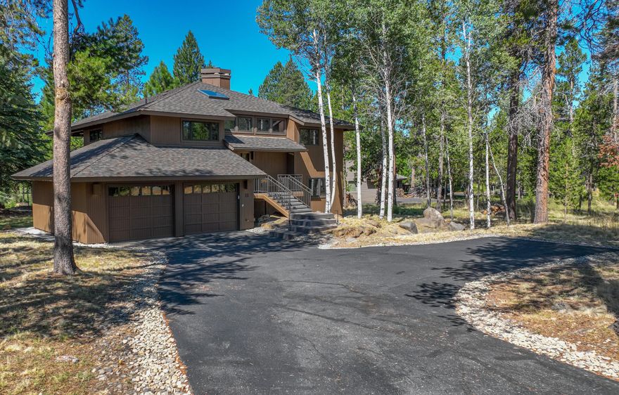 Truly exquisite 2019 full-home remodel with amazing high-end NW finishes throughout! Enjoy a reverse living, tree house feel in the vaulted great room w/ gas start wood burning FP & huge wall of windows offering golf course views! Kitchen features granite counters, stainless appliances, eating bar & tons of cabinetry w/ soft-close hardware. Covered upper deck expands the great room area to take the party outside! Lovely primary suite offers private access to the upper deck plus a lovely bath with double quartz vanity, jetted soaking tub, walk-in rain shower & large walk-in closet. A powder bath completes the upstairs. Downstairs is a laundry room/powder bath, 3 guest bdrms & a second full bath w/ double vanity & tub/shower combo. Covered spacious deck space w/ newer hot tub. 50-year comp roof installed 2018. High-end wood clad windows, sliders, skylight, furnace, A/C & HWH, decking, custom railing included in 2019 remodel. 2-Car finished garage. Ext Paint 2020. SHARC Paid!