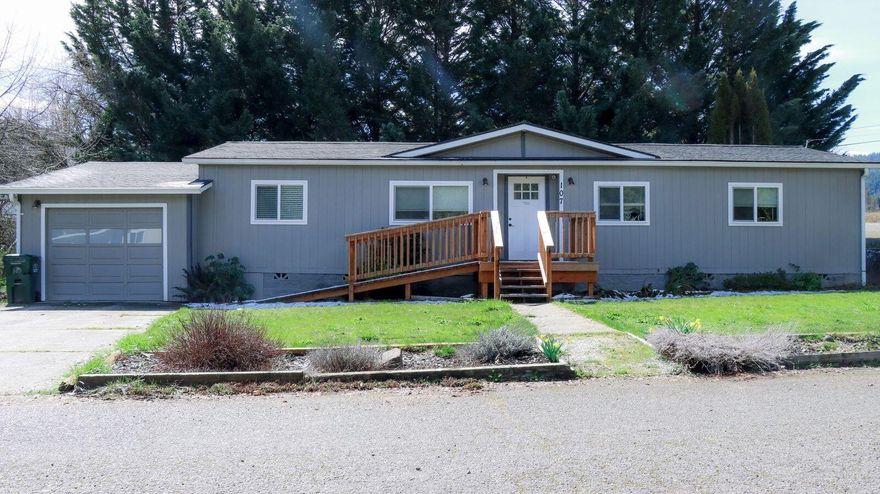 Adorable 3 bedroom, 2 bath split floor plan home that is like New & Ready to Move In! this 1404 sq.ft. home features vaulted ceilings, an open floor plan that allows for an abundance of natural light. New heat pump in 2021. Fully fenced large .19 acre lot. Easy access ramp to front porch and all on one level. A covered back porch with privacy to enjoy during those hot summer days. This home offers plenty of parking and a one car garage with a workshop for hobbies or projects.