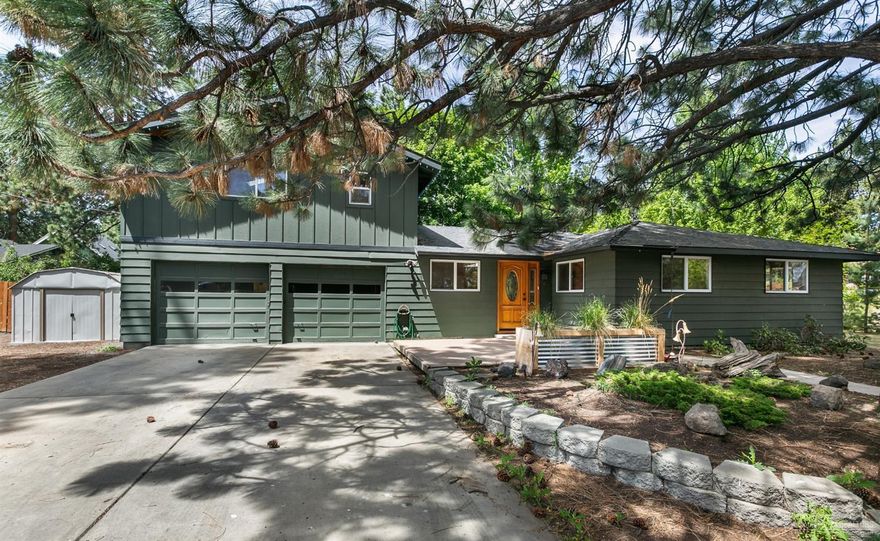Motivated Seller! Charming updated home under the shelter of two giant Ponderosa Pine trees. Unbeatable location along the newly minted 15th Street Neighborhood Greenway Project, close to the growing OSU Cascades campus, dining, shopping and breweries. This large corner lot features plenty of parking with room for an RV or boat, thoughtful landscaping, custom raised beds and tons of private deck space. Gorgeous kitchen showcases Hickory cabinets, glass tile back splash and solid surface counter-tops. Upstairs bonus room could be used as a 4th bedroom or a separate living area with a full bathroom, pre-plumbed for a kitchenette. Wood burning fireplace insert in the great room and a newer gas furnace with central A/C.
