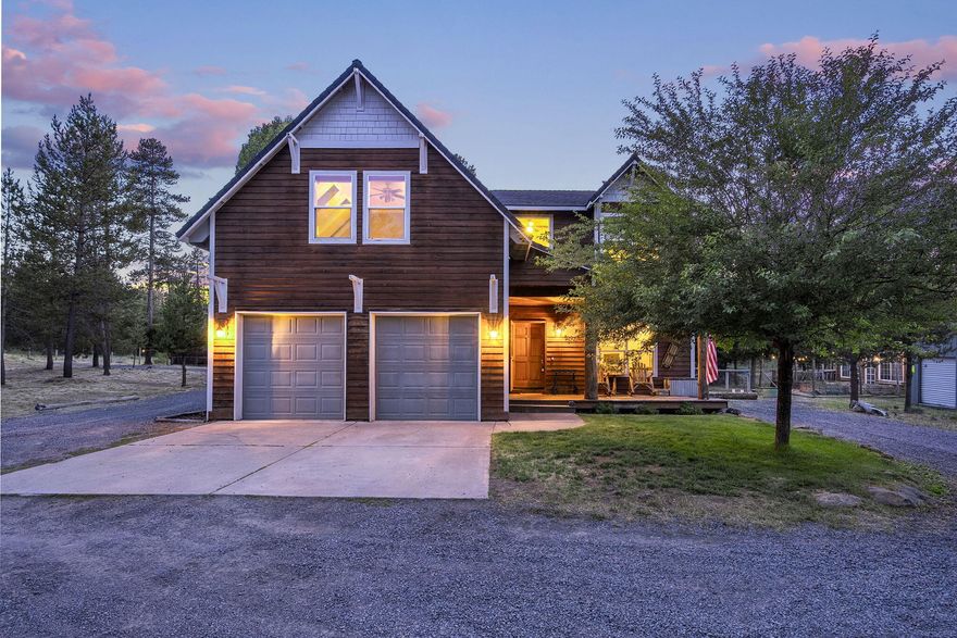 Custom 2,425 sqft home on over 2 fully fenced acres with a 30x36 shop and RV storage. This 3-bedroom, 2.5-bath residence includes an office and bonus room. Open entry with 9ft ceilings throughout, vaulted in primary suite and bonus room. Great room features a cozy wood-burning stove and log accents. Chef's kitchen boasts a gas Wolf range, slab granite countertops, under-cabinet lighting, and walk-in pantry. Primary suite offers a large soaking tub, tiled shower, dual vanity, and two walk-in closets. Convenient laundry room with sink, built-ins, and laundry chute. Attached 3-car tandem garage with ample storage. Built-in speakers enhance indoor and outdoor entertaining areas. Expansive composite back deck  and fenced backyard. Permitted shop with RV space (14ft door), loft, and power outlets. Includes 10x20 shed, greenhouse, raised garden beds, deer-proof fence, watering system, 1,500gal cistern, and 1,000gal propane tank.