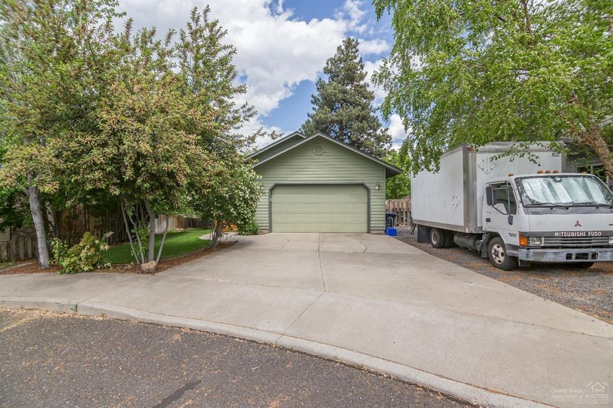 Fantastic family home on a quiet cul-de-sac. Great room, kitchen and master on main level, additional 3 bedrooms, full bath, and second living room downstairs. Large storage room with separate entrance. New carpet and interior paint. Fully landscaped and fenced yard with hot tub. RV/boat parking. Back gate opens to canal and newly installed trails. Minutes to the Old Mill.