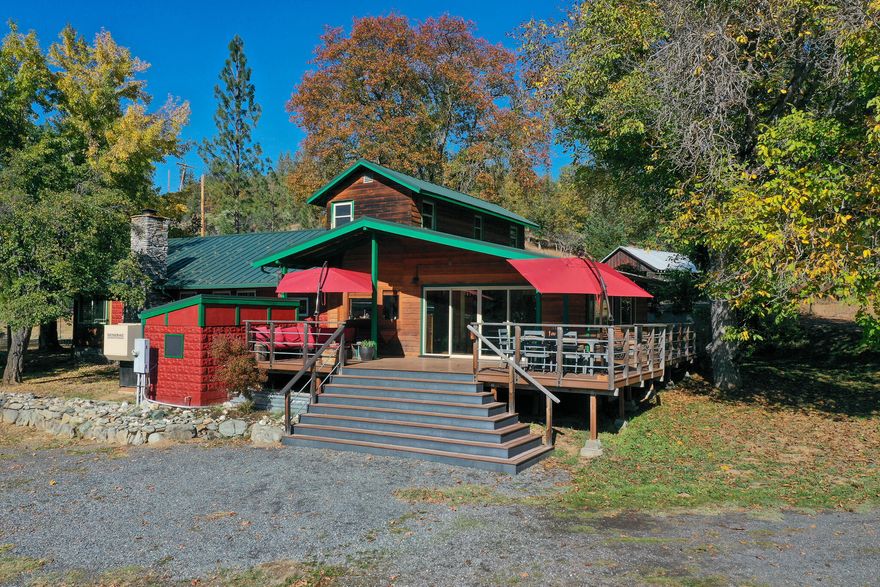 Live the dream! Large historic home plus second home site (currently mobile home), with separate wells and septic. RV site w/hook ups. Plenty of room to park toys. 6 stall Mare Motel and tightly fenced pastures with room to grow! 100 vine mature vineyard, fruit trees, large deer fenced garden, water rights. Detached mechanics garage with 4 bays, mechanic's pit and additional work/office space. Primary residence has large great room open to wraparound Trex deck w/sunny mountain views above the fog line. Huge kitchen features Viking stove and bay window. Updated bathroom and laundry. Primary bedroom on main floor adjoins office/craft space and walk-in closet. Large family room with high capacity Blaze King woodstove. 3 separate guest rooms plus large upstairs attic. Brand new Bruce & Dana metal roof, fantastic cable internet, low cost property taxes as Woodland Resource, plus large root cellar. Exponential agritourism opportunities. Borders BLM, be your own neighbor!