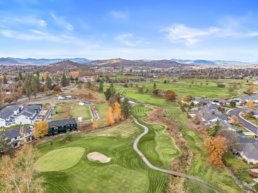 Experience Resort-Style Living at 210 Bogey Lane in Eagle Point's Premier Golf Course Community! This stunning home boasts breathtaking golf course views and an open floor plan perfect for entertaining. The gourmet kitchen features a center island, breakfast bar, and walk-in pantry, while the primary suite offers a double vanity and spacious walk-in closet. Enjoy exceptional community amenities including a sparkling pool, pickleball courts, clubhouse, and dog park. Whether teeing off for a morning round, taking a refreshing swim, or relaxing with serene golf course vistas, this home offers an unparalleled Southern Oregon lifestyle that seamlessly blends comfort, convenience, and recreation in one of Eagle Point's most desirable neighborhoods.