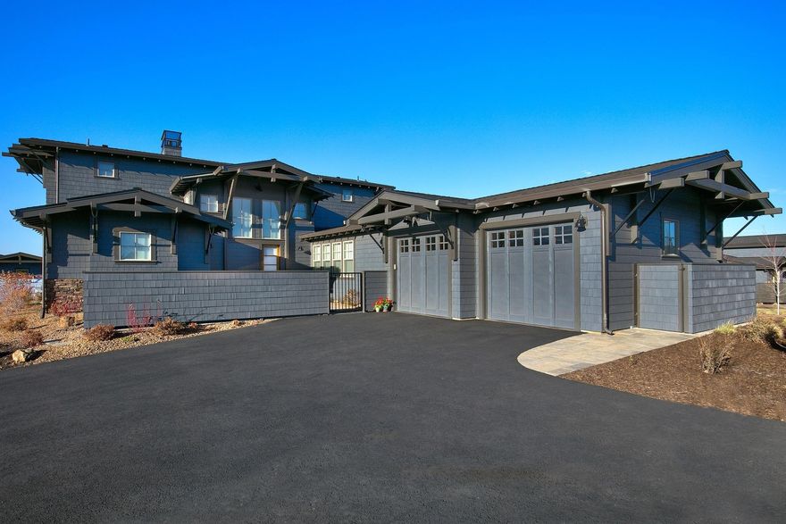 Stunning one of a kind NW Contemporary with an open floor plan & luxurious master suite on the main level. The light-filled great room features soaring ceiling & lots of windows, a stone fireplace & beautiful hardwood floors. Tour of Homes award winning kitchen is a chef's delight, boasting a large granite island with prep sink, quartz counters, Thermador appliances, & huge walk-in pantry. The adjacent dining area opens to the paver patio extending along the rear of the home, with access also from the master suite. Upstairs, the 2 en-suite guest rooms are connected with a sky bridge. Both have private balconies with sweeping Cascade & golf course views. The spacious front courtyard, gated & fenced, has peeks of the mountains. Sited on a flat, large corner lot, adjacent to common area. Conveniently located in The Rim neighborhood of Tetherow, close to the pools, fitness center, clubhouse & restaurants; easy access to Phil's Trail network, the Deschutes River & the road to Mt Bachelor!