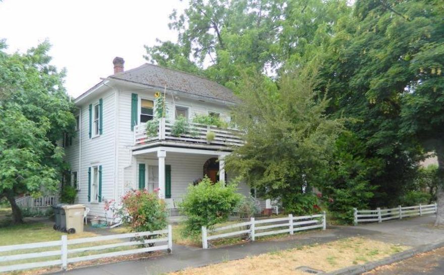 5 Plex in NW Grants Pass on large city lot.  This Grand Old Lady is needing a little love.  Built in 1915 the two story unit with covered front porch has  4 -1 bedroom apartments. The attached Cottage is 2 bedroom.  Units 1 and 2 have access to the balcony. Beautiful yard.  Each unit has Separate meters for gas & electric.  All units in good condition.  L:aundry facility. HUD Tenants in units 2 & 5. Landlord pays water/sewer/trash. Property is being sold as is.