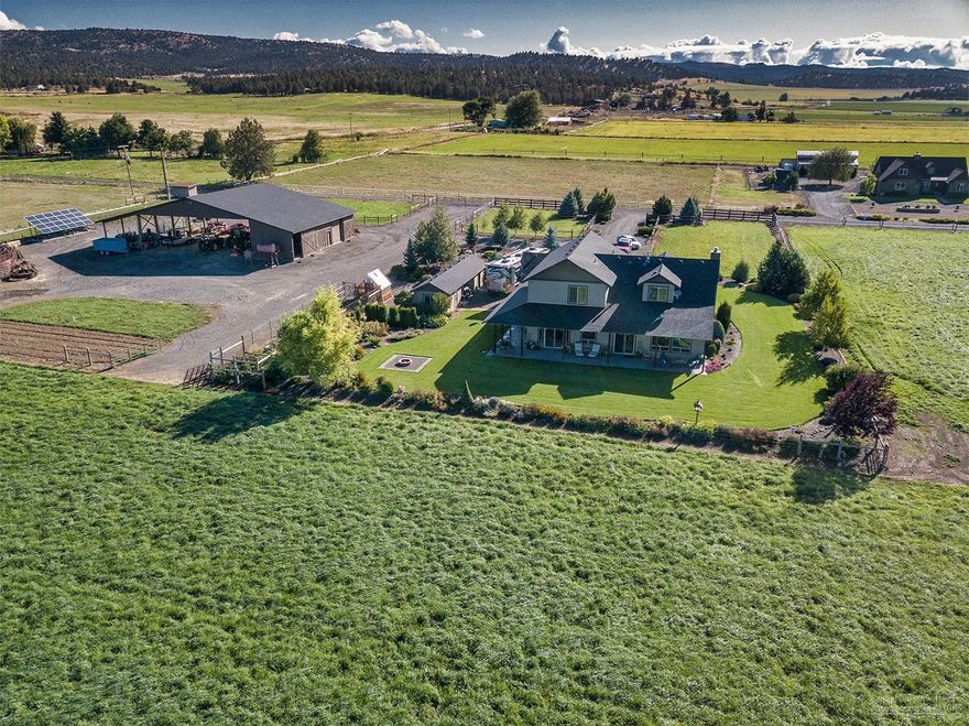 Meticulous inside & out. Extras include a walk in closet for each bedroom, tile, carpet & pre-finished wood floors, upgraded Forced Air heating & A/C, 1000 gallon propane tank, Reverse Osmosis water treatment system, raised garden bed in the fenced garden area, concrete driveway, 2 RV hookups w/water & electric, propane generator, gated entry & much more. 60X100 hay shed w/enclosed shop & storage area. Also a 12X48 RV & storage shed. 52.2 acres of Ochoco Irrigation Water rights & 50 acres of productive Orchard Grass hay. Irrigation system is included. OID Water is $3489.80 per 2019.