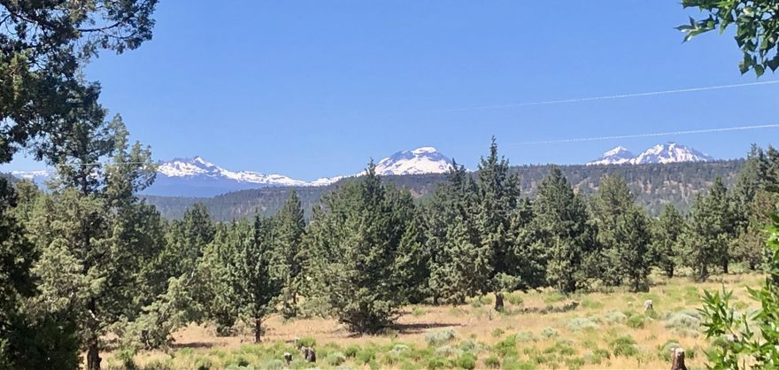 An amazingly special 1 owner home. A Hand Scribed Log Home w/ Cascade Mtn & Easterly Views. A large deck for entertaining & taking in the Mtn Views. All nestled in the mature pine trees that surround you. The home has an open floor plan w/ oversized Log Beams & 2 Bedrooms to each side plus the 3rd bedroom below currently used as an art studio w/ plumbing & an egress door & windows off of its private entrance & patio area & separate driveway. The oversized kitchen has new Stainless Steel Appliances & a large Island for gatherings. This home has been lovingly cared for, nice privacy & a great location between Faith, Hope & Charity Vineyards with Wine Tastings, Meals & Entertainment & Rainshadow Organics, Farm to Table Dinners & daytime dining & an Organic Farm Store. Paved to the property between Terrebonne & Sisters, surrounded by the Cascade Mtns w/ Horse & Hiking Trails nearby. Property is fenced for horses. This is the Central OR Home of your Dreams!