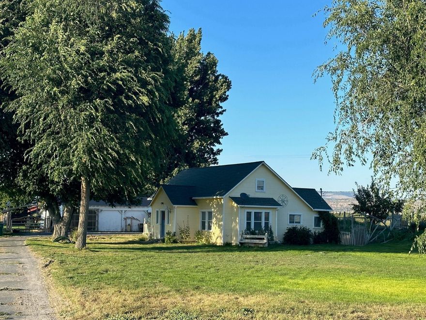 Rare find! This great small acreage property features a charming farmhouse, garage with workshop, large metal shop, rustic wood barn, and multiple sheds. Just minutes to the town of Tulelake, California and Klamath County, Oregon - this home and park-like grounds are surrounded by acres of farm fields that provide privacy and country living - without the work! The home is ready for your personal touches to make it your own, but is quite livable as it sits. Downstairs, you'll find two bedrooms, a cozy kitchen, comfortable living room and bathroom. Up the stairs is the third bedroom - which is quite large with lots of storage!