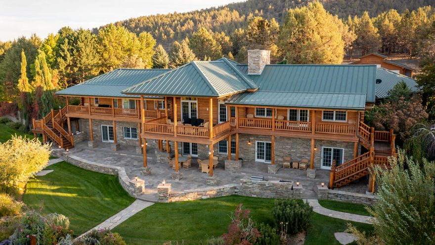 This ranch has an absolutely incredible log built home that overlooks beautiful farmland for miles! Featuring a large 3 bay shop, a horse barn w/ 5 stalls, each stall w/ heated water, irrigation well and 1 acre irrigation bulge pond w/ trophy bass! Enjoy the massive covered deck for entertaining guests or family while taking in the abundant wildlife and views. Peacefulness, serenity, gratitude..all in one place. Manual gate begins the awesome entrance with stacked stone lining the driveway and makes for a grand entrance upon arrival! The downstairs has tall ceilings and the upstairs is vaulted. As soon as you walk through the front door, you can see the views through the windows and sliding door, and feel like you've just entered a grand lodge out of a movie set. With over 470 acres combined, and 4 parcels, approximately 30 of which for farming or grazing, this ranch could be your Yellowstone! Owner Carry financing available, with one million down, at 5% interest for qualified buyer.