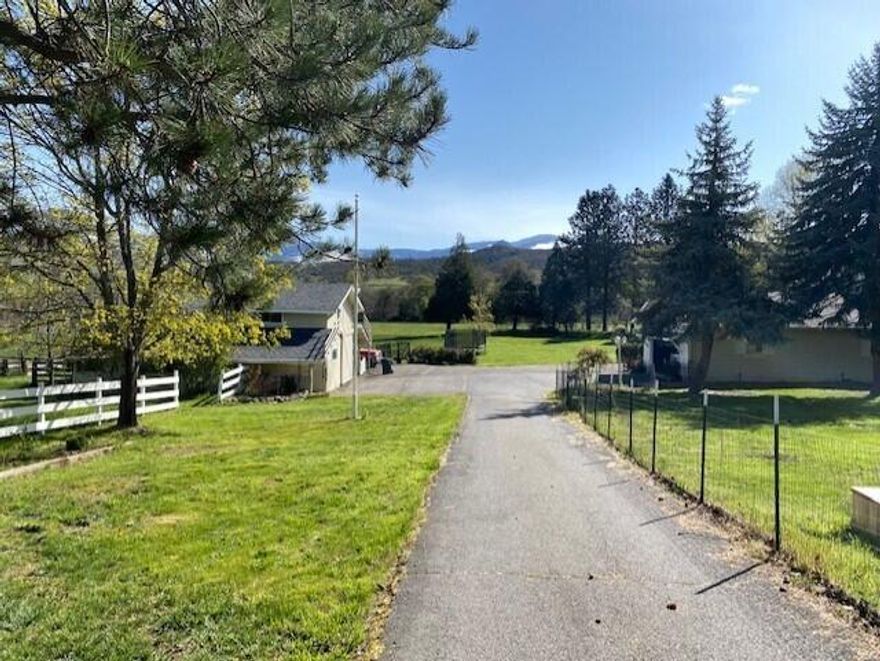 Gorgeous, beautifully built 4 bed 3.5 bath home on 10.04ac.You will feel right at home on this peaceful country property minutes from Ashland perfectly situated on level acreage w/ views of Emigrant Lake, mountains & Pilot Rock. The front entry opens to lg living room w/ fireplace, view windows, hardwood floors, stunning library, formal dining room w/ French doors to patio & garden area. Main level has an office w/ views in 3 directions, private guest bedrm w/ deck access, full bath, kitchen w/ pantry & views. Upper level offers primary suite w/ mountain & pasture views, spacious sunny bathroom w/ walk-in shower, 2 additional lg bedrooms w/ oversized bathroom. Hunter Comm. provides dedicated WIFI. Outbuildings inc barn w/office, game room, hay loft, wired shop & tool shed. Enjoy the orchard w/ numerous fruit trees, grapes & vegetable beds.10ac parcel has TID irrigation, grows hay and/or cattle grazing. Adj. 2.4 ac parcel offered sep. for $295K. Great potential for a two family set up.